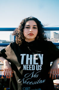 THEY NEED US BLACK T-SHIRT